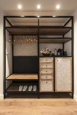a walk in closet with black shelving at Hotel Barcelona Catedral 4 Sup in Barcelona