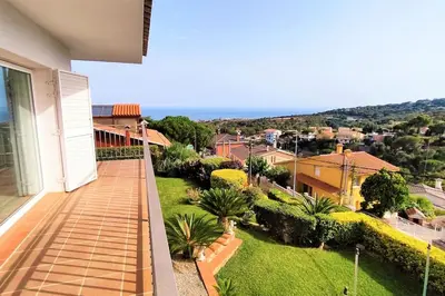 a balcony of a house with a view of a city at VILLA VALENTINA in Mataró