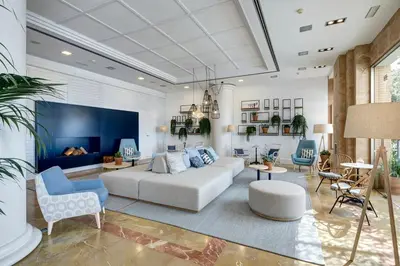 a living room with a couch and some chairs at Sercotel Kalma Sitges in Sitges