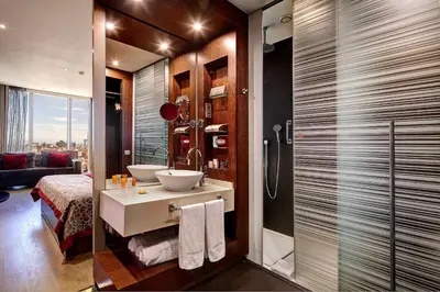 a bathroom with a sink and a shower with a toilet at Olivia Plaza Hotel in Barcelona