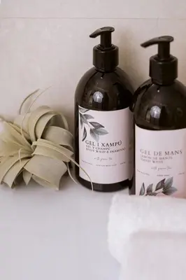 two bottles of wine sitting next to each other at Apartamentos Marfina in Castelldefels