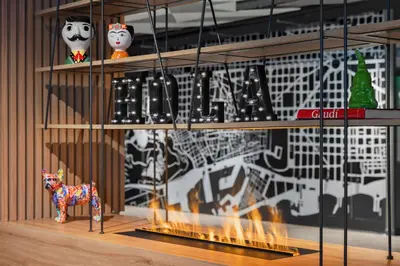 a shelf with shoes and a toy horse on it at Moxy Barcelona in Barcelona