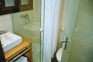 a bathroom with a toilet and a sink and a shower at BCN2STAY Apartments in Barcelona