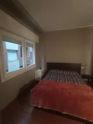 a bedroom with a bed and a window at SWEET APARTMENT IN GRACIA DISTRICT! in Barcelona
