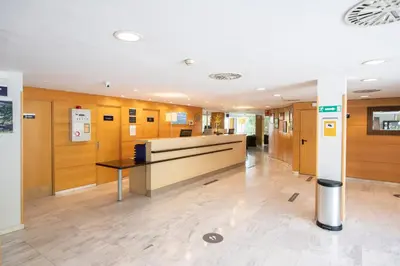 a lobby of an office with a reception desk at Holiday Inn Express Barcelona - Montmeló by IHG in Granollers