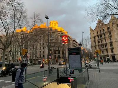 a person walking on a city street with a building at Bright Apt with Private Terrace in Sant Antoni in Barcelona