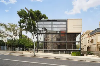 a glass building on the side of a street at Ikonik Anglí in Barcelona