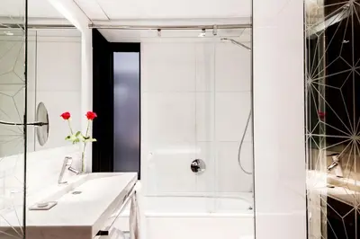 a bathroom with a shower and a sink at Hotel Granados 83, a member of Preferred Hotels & Resorts in Barcelona