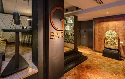 a bar with a staircase and a sign on the wall at Hotel Granados 83, a member of Preferred Hotels & Resorts in Barcelona