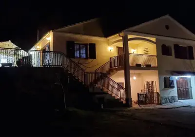 a house at night with a staircase in front at Casa Donaire in Marganell
