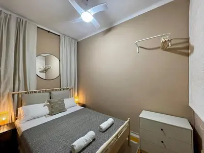 a small bedroom with a bed and a mirror at The Collection Barcelona - Sagrada Familia 4BD only for Families or Business groups in Barcelona