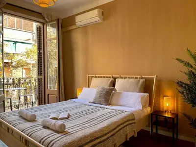 a bedroom with a bed with two books on it at The Collection Barcelona - Sagrada Familia 4BD only for Families or Business groups in Barcelona