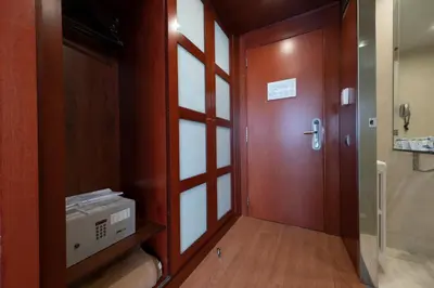 a room with a door and a room with a machine at Best Western Hotel Mediterraneo in Castelldefels