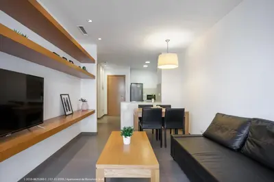 a living room with a couch and a table at Flateli Navas D01 in Barcelona