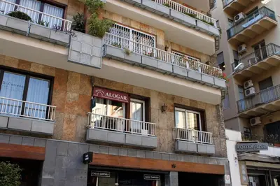 a building with balconies on the side of it at Hostal Alogar in Barcelona
