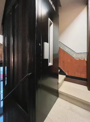 a black door in a hallway with stairs at Stay U-nique Apartments Murillo in Barcelona