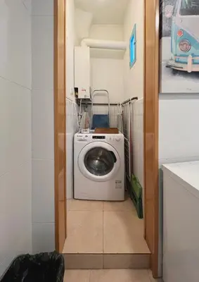 a washer and dryer in a small room at Stay U-nique Apartments Murillo in Barcelona