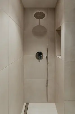 a shower with a glass door in a bathroom at Petit Luxe Volta ÀTIC in Terrassa