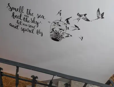 a wall with a heart and some butterflies at Fira BOUTIQUE by MyRentalHost in Hospitalet de Llobregat