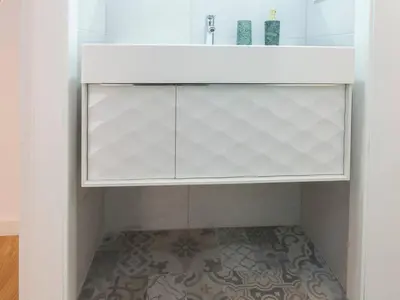 a white cabinet in a bathroom with a tile floor at Colour Pop FIRA by MyRentalHost in Hospitalet de Llobregat