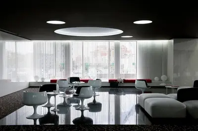 a conference room with chairs and tables and a large window at Barceló Sants in Barcelona