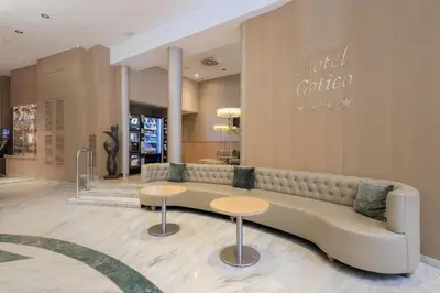 a store lobby with a couch and two tables at Hotel Gótico in Barcelona