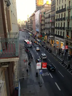 a view of a busy city street with cars at Hotel Pelayo in Barcelona