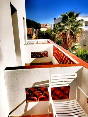 a white staircase on the side of a building at Cèsar in Vilanova i la Geltrú