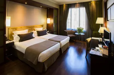 a hotel room with a large bed and a television at Hotel Barcelona Center in Barcelona