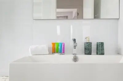 a bathroom counter with a sink and a mirror at Sunset Boutique Castelldefels by MyRentalHost in Castelldefels
