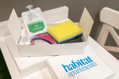 a white box with different items in it at Habitat Apartments Alissia in Barcelona