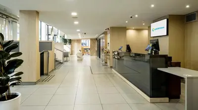 an empty lobby of a hospital at Ilunion Auditori in Barcelona
