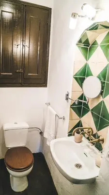a bathroom with a toilet and a sink at Cal Castlà in La Granada