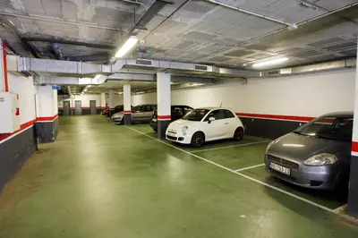 a parking garage with several cars parked in it at Travelodge Barcelona Fira in Hospitalet de Llobregat