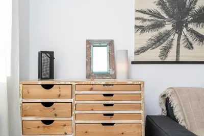 a dresser with a mirror on top of it at Click&Flat Rizal in Barcelona