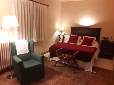 a kitchen with a table and a grill in a trailer at Hotel Golf Can Rafel in Corbera de Llobregat