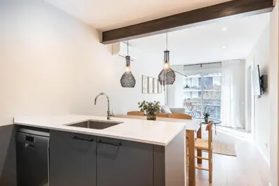 a kitchen with a sink and a counter top at Style and design in the best location, Eixample Barcelona in Barcelona