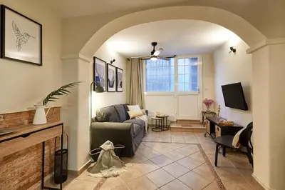 a living room with a couch and a tv at BBarcelona Parallel Apartment in Barcelona