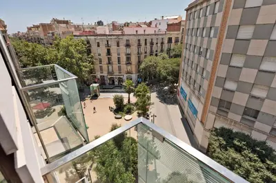 an apartment balcony with a view of a courtyard and buildings at Enjoy Apartments Maria II in Barcelona