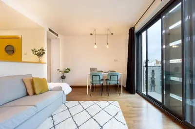 a living room with a couch and a table at Enjoy Apartments Maria II in Barcelona