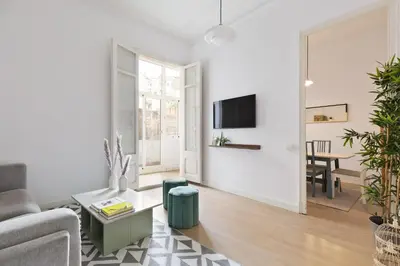 a living room with a couch and a table at Sagrada Familia II by Enjoy Apartments in Barcelona
