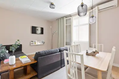 a living room with a table and a couch at Sagrada Familia III by Enjoy Apartments in Barcelona