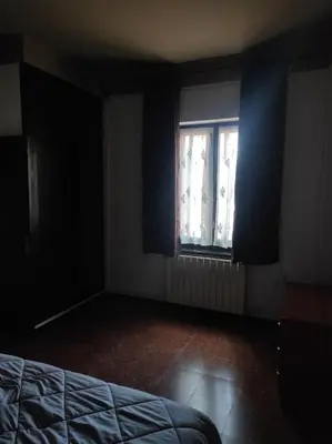 an empty room with a bed and a window at Apartamentos Can bruguera 2 in Mataró