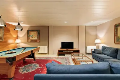 a living room with a pool table at PARK SEDO Aparthotel in Rubí