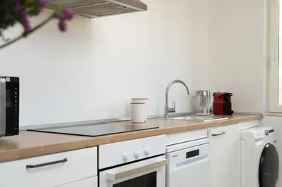 a kitchen with a sink and a counter top at SibsBcn-Paseo de Gracia Penthouse-Luxury-Terraces in Barcelona