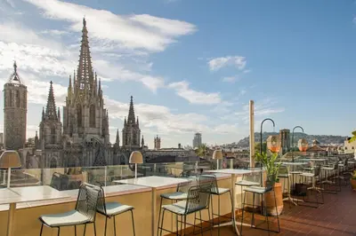 a balcony with chairs and a view of a city at Lamaro Hotel Barcelona - Preferred Hotels & Resorts - Lifestyle Collection in Barcelona