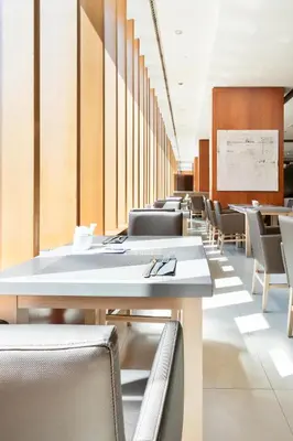 a row of tables and chairs in a cafeteria at Hotel Best Front Maritim in Barcelona