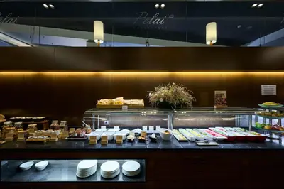 a buffet line of food in a restaurant at Catalonia Ramblas 4* Sup in Barcelona