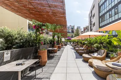 a balcony with couches and a view of a city at Catalonia Ramblas 4* Sup in Barcelona