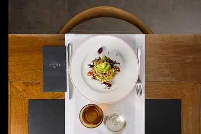 a plate of food sitting on top of a table at Hotel Villa Emilia in Barcelona